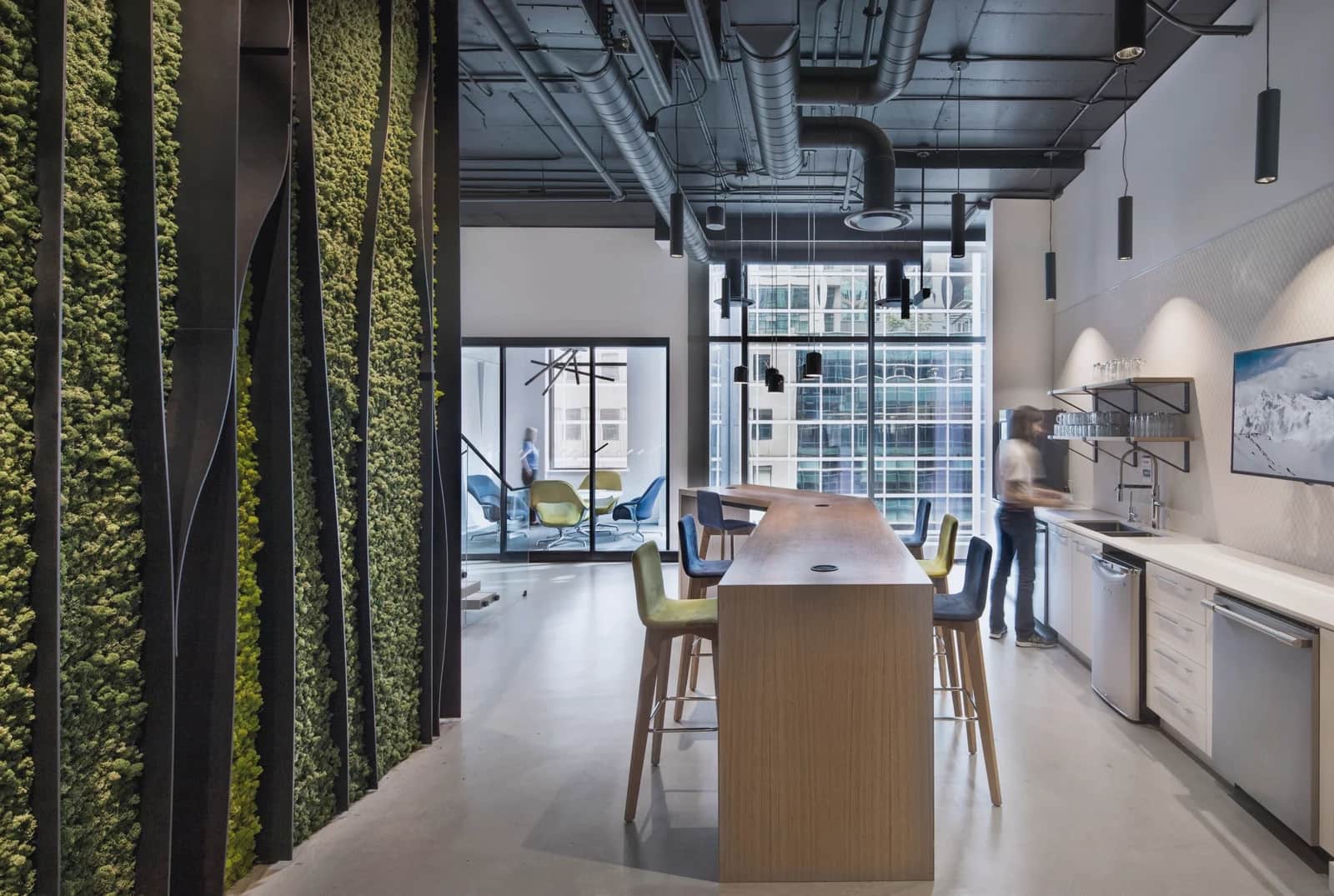 Living-wall stair, Toronto: Office kitchen and seating beside a floor-to-ceiling living moss wall