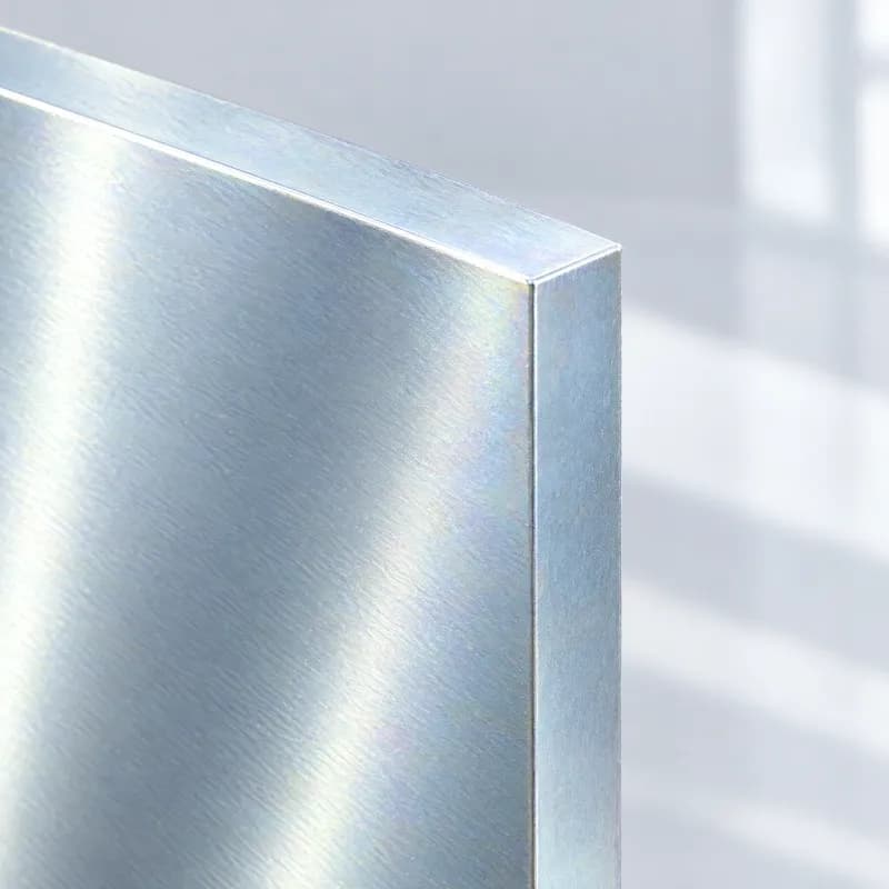 Steel plate corner with a bright, bluish metal plating